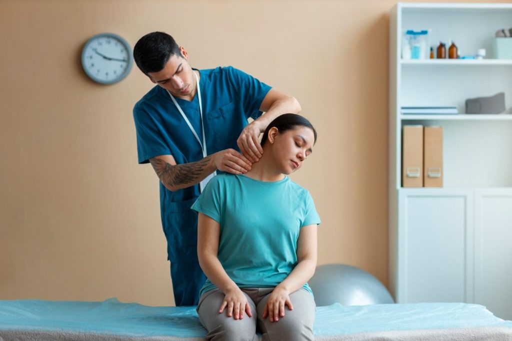 Chiropractor adjusting a patient’s neck to improve alignment and motion