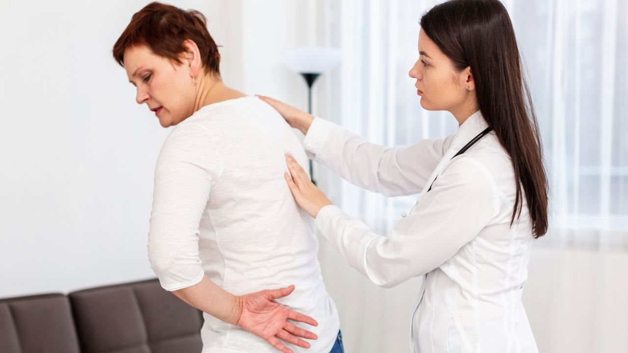 Chiropractor providing gentle care to a patient during a consultation