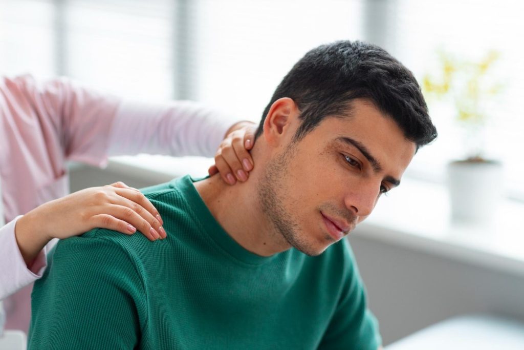 Patient receiving rehabilitation exercises during chiropractic treatment