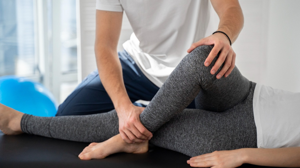 Chiropractor performing foot adjustment to support alignment