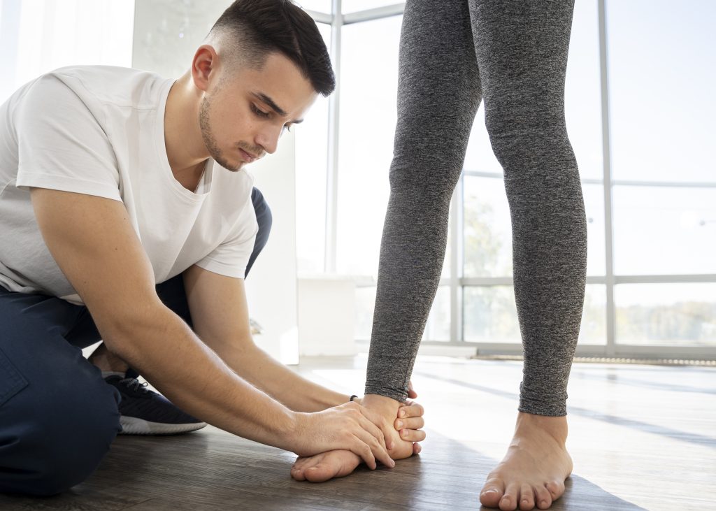 Close-up of chiropractor providing focused care on a patient’s foot