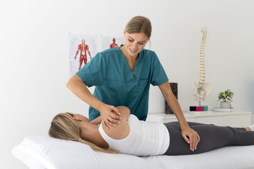 Chiropractor adjusting a patient during a session at the clinic