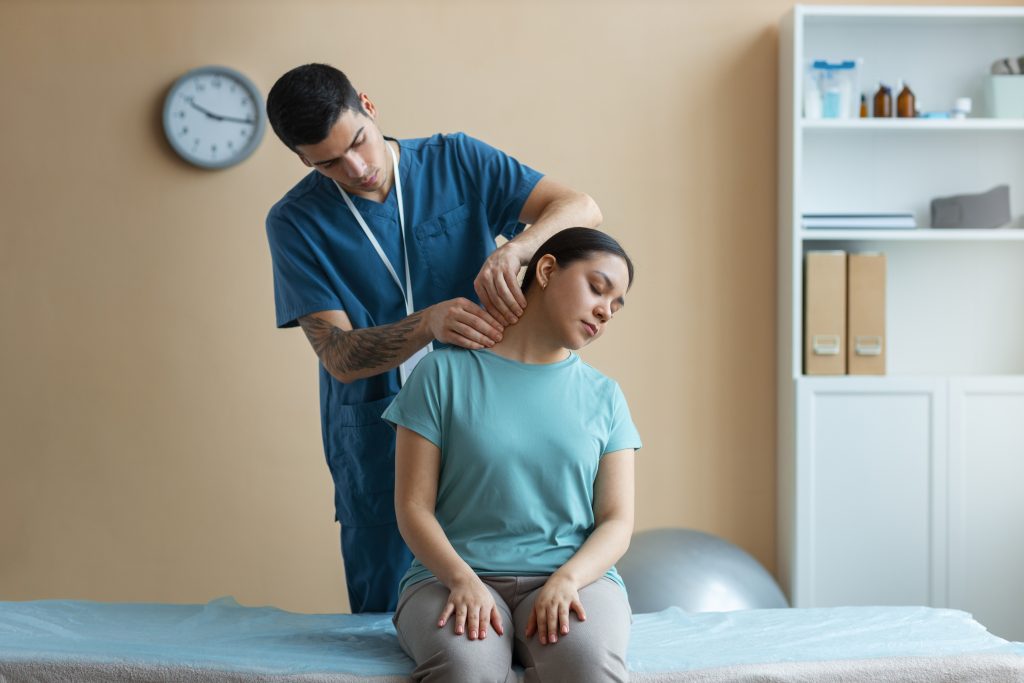 Woman receiving chiropractic adjustment during treatment session
