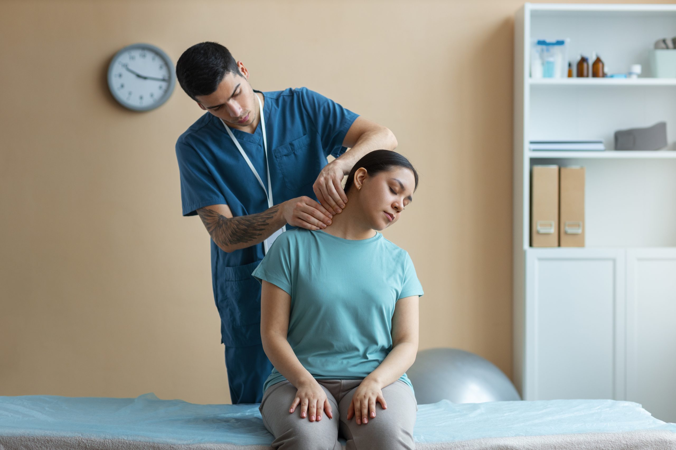 Woman receiving chiropractic adjustment during treatment session