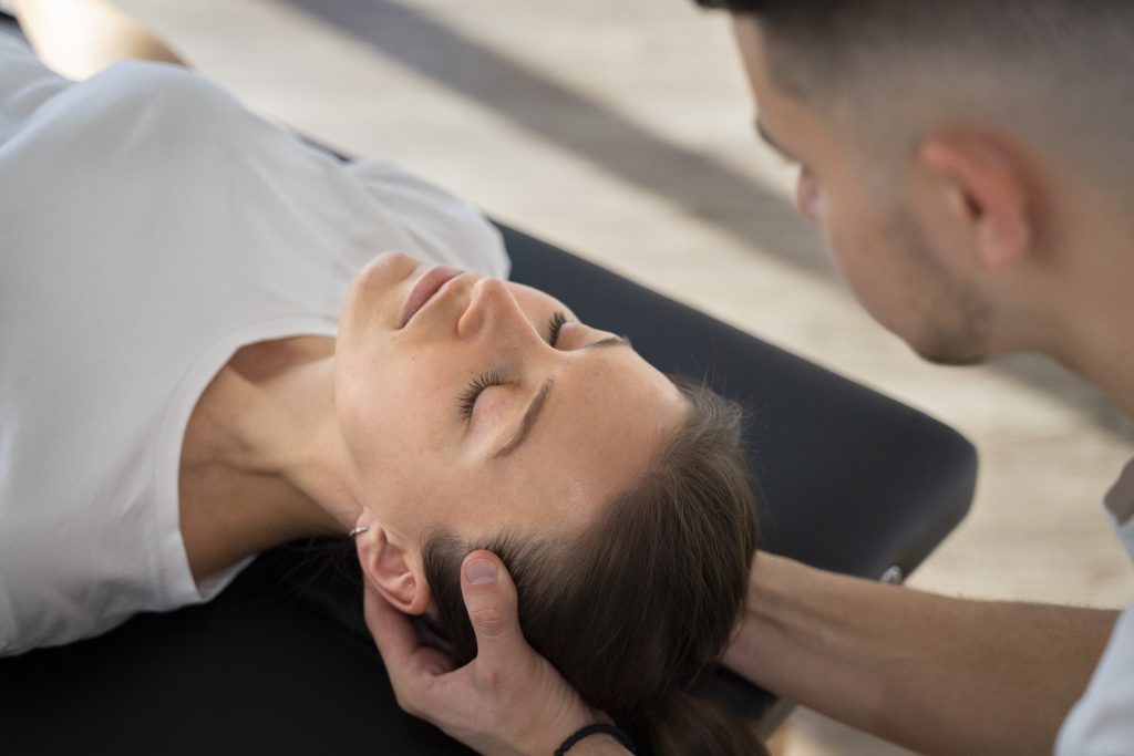 close-up-therapist-holding-patient-s-head
